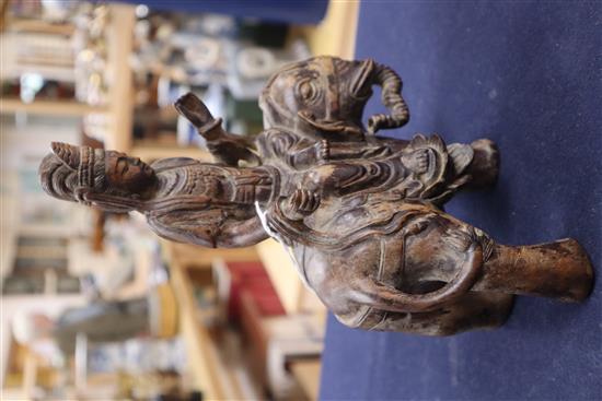 A Chinese wood carving of Guanyin on elephant, Qing height 24cm